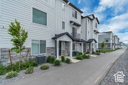 View of asphalt road with a residential view