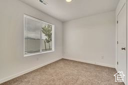 Spare room featuring baseboards