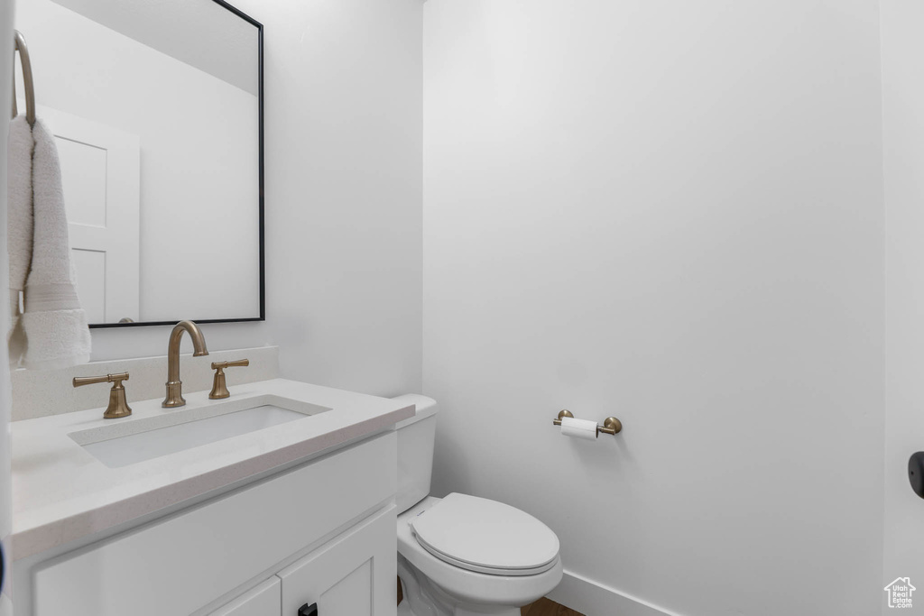 Bathroom with vanity and toilet