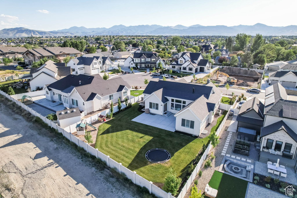 Aerial view of residential area featuring a mountain backdrop