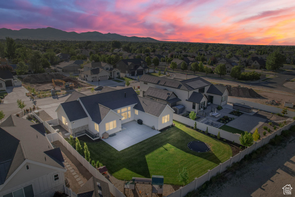 Aerial view at dusk of a mountain view and a residential view