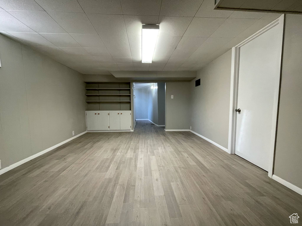 Empty room featuring wood finished floors and baseboards