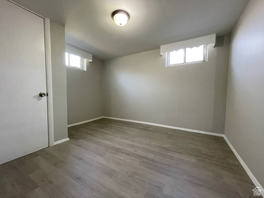 Below grade area featuring wood finished floors and baseboards