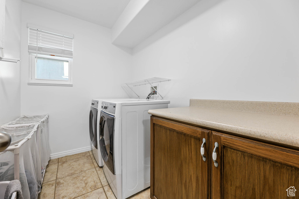 Washroom with washing machine and dryer and cabinet space