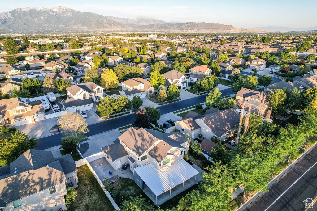 Aerial view of residential area featuring a mountain backdrop