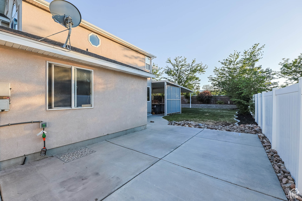 Fenced backyard with a patio area