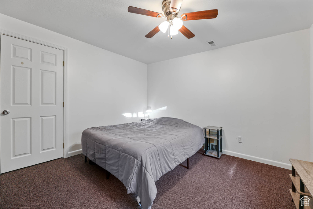 Bedroom with carpet floors and a ceiling fan