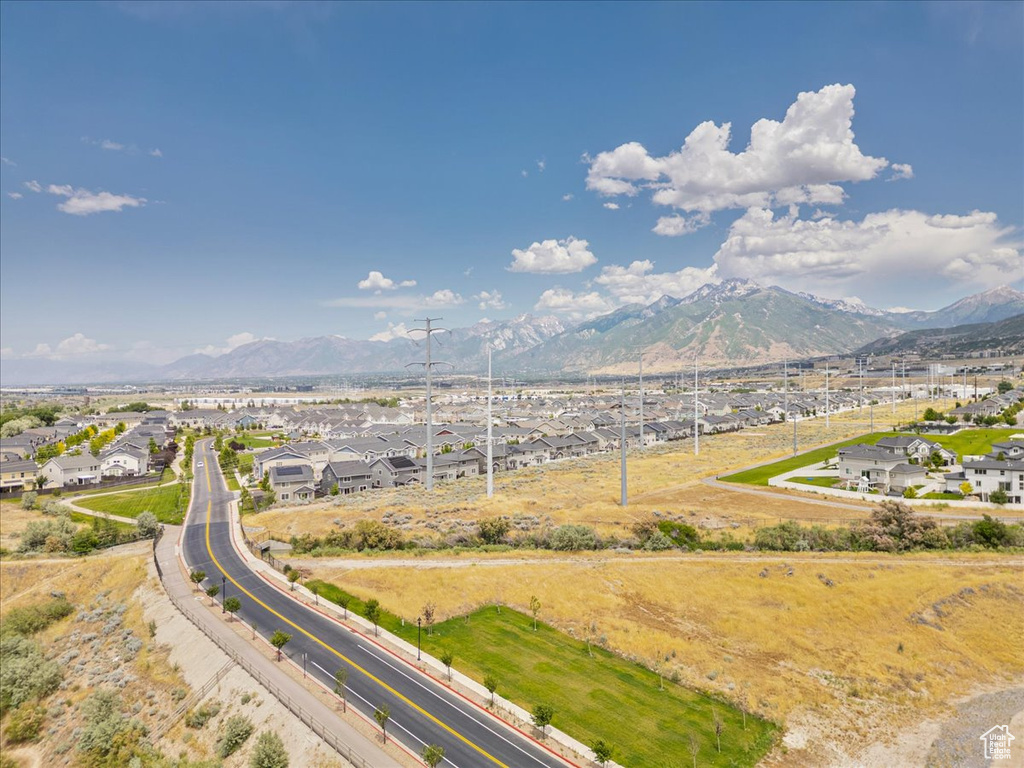 View of mountain backdrop featuring nearby suburban area