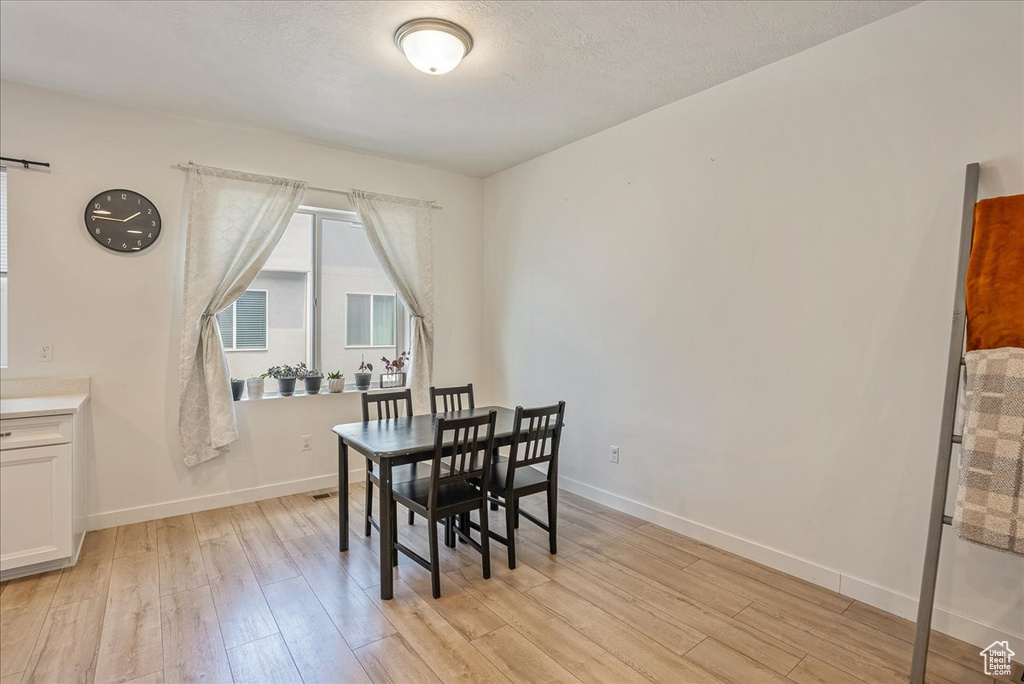 Dining room with light wood finished floors