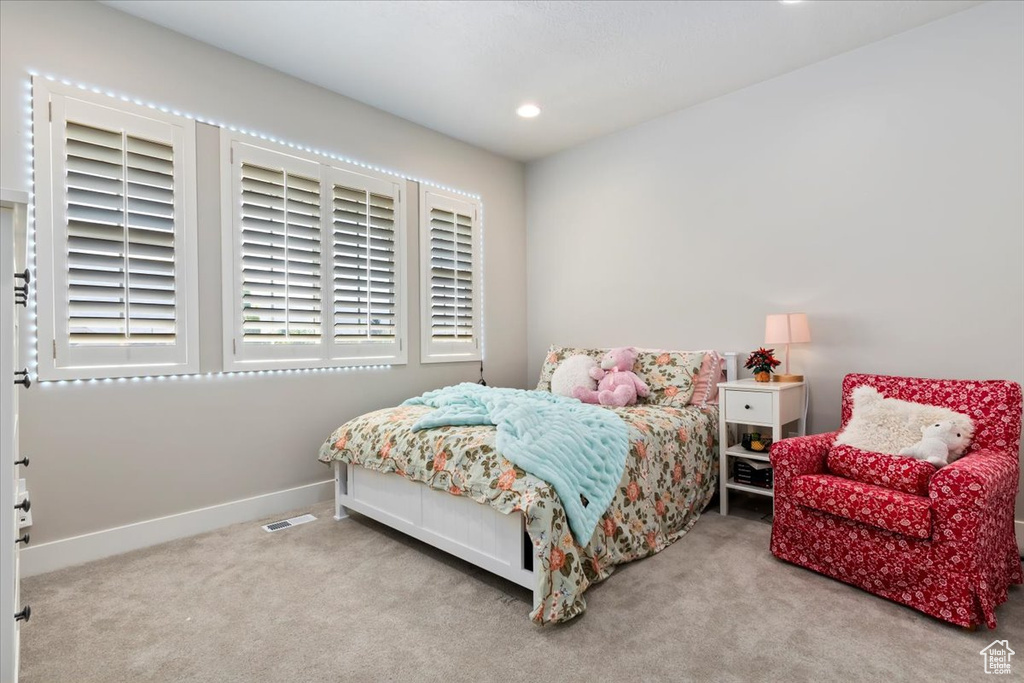 Carpeted bedroom featuring baseboards and recessed lighting