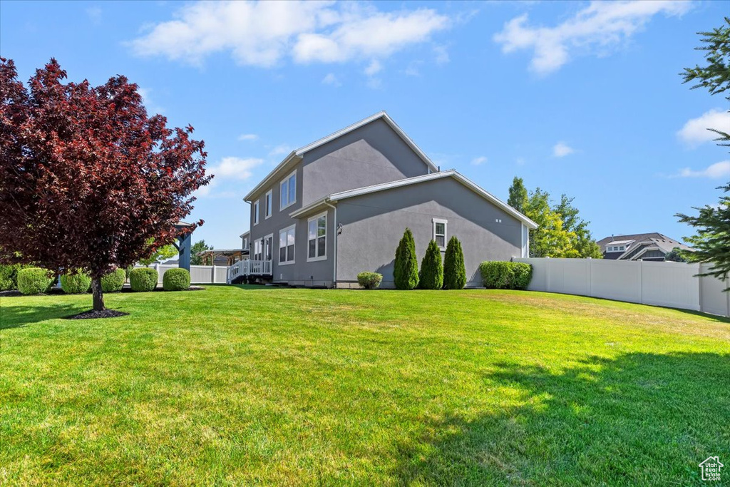 View of side of property featuring stucco siding
