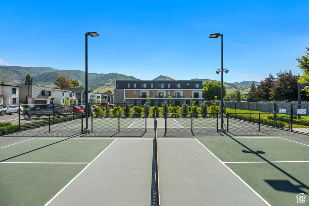 View of tennis court featuring a mountain view