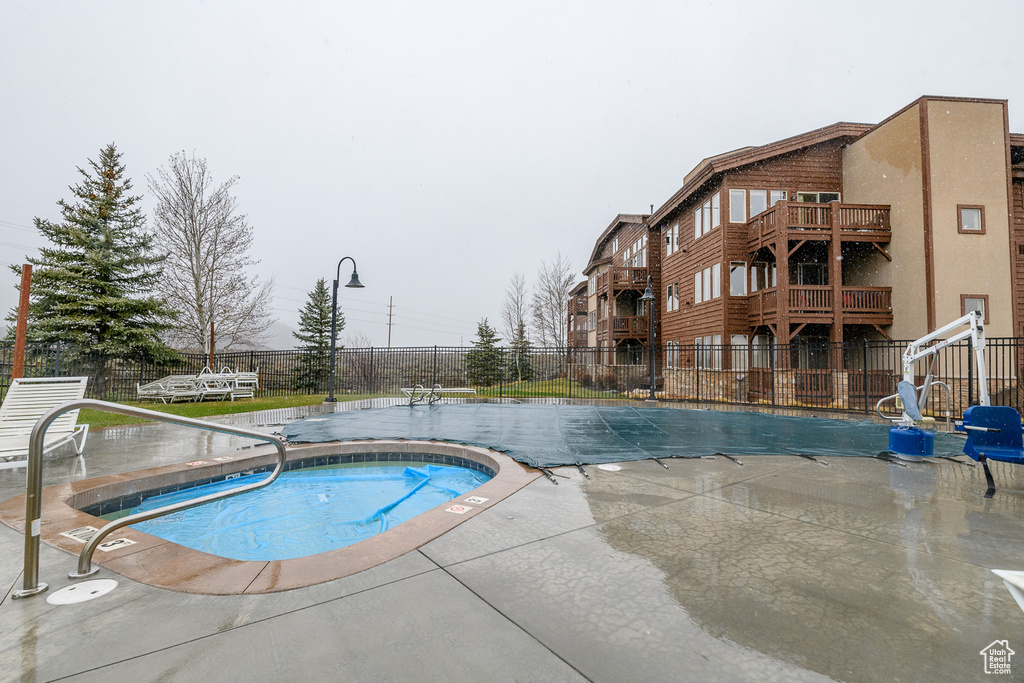 Community pool featuring a patio