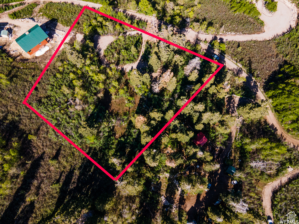 Aerial view of sparsely populated area featuring property boundaries highlighted