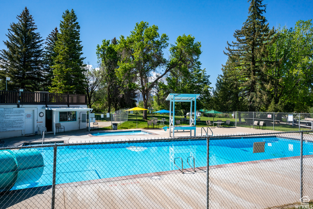 Community pool featuring a patio area