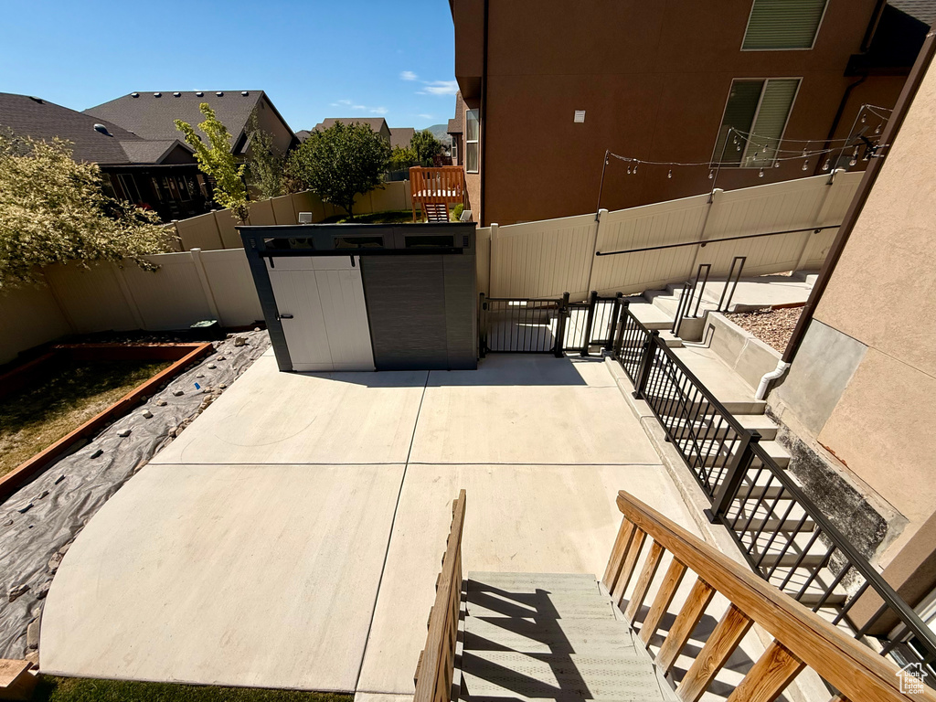 View of patio featuring stairway