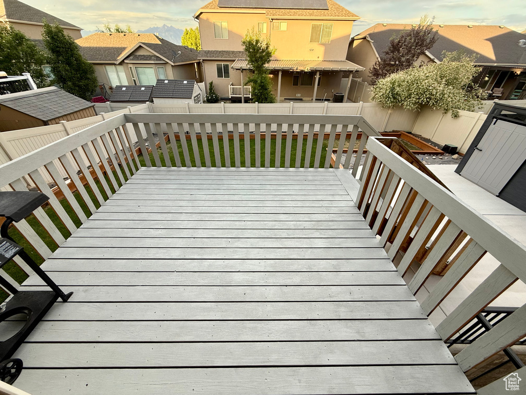 Wooden deck featuring a fenced backyard and a residential view