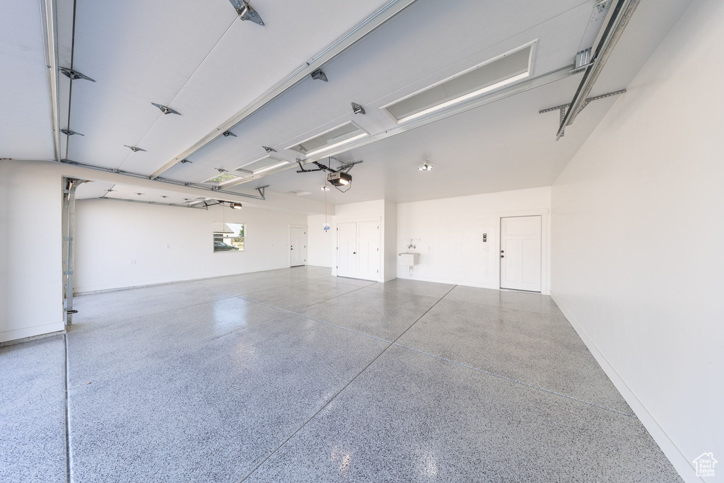 Garage featuring baseboards