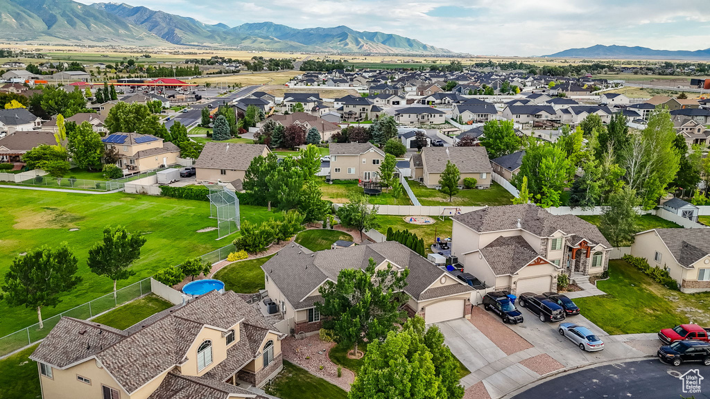 Aerial view of residential area featuring a mountainous background