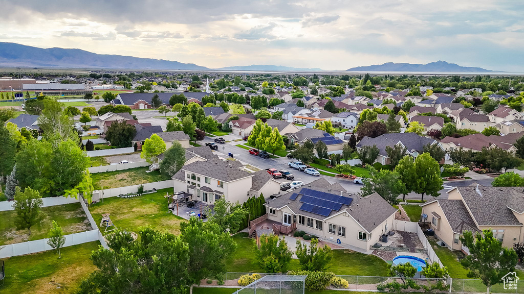 Aerial view of residential area featuring a mountainous background