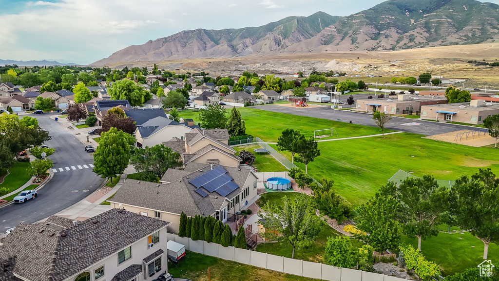 Aerial perspective of suburban area with a mountainous background