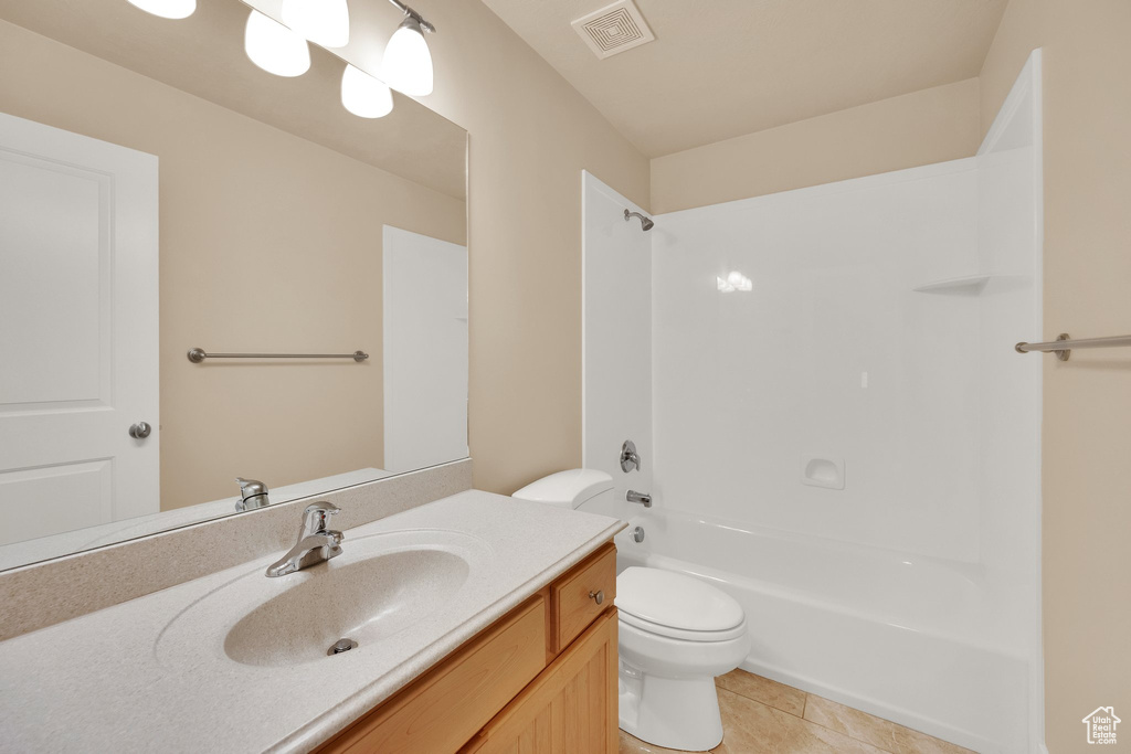 Full bathroom with vanity, tile patterned floors, and  shower combination