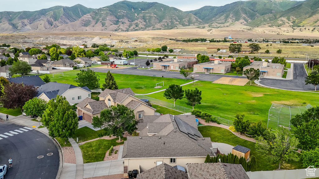 Aerial perspective of suburban area with a mountain backdrop