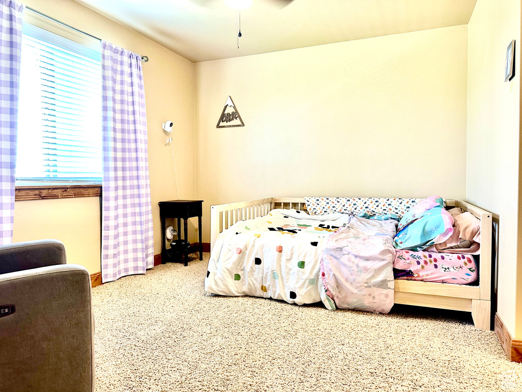 Bedroom with multiple windows