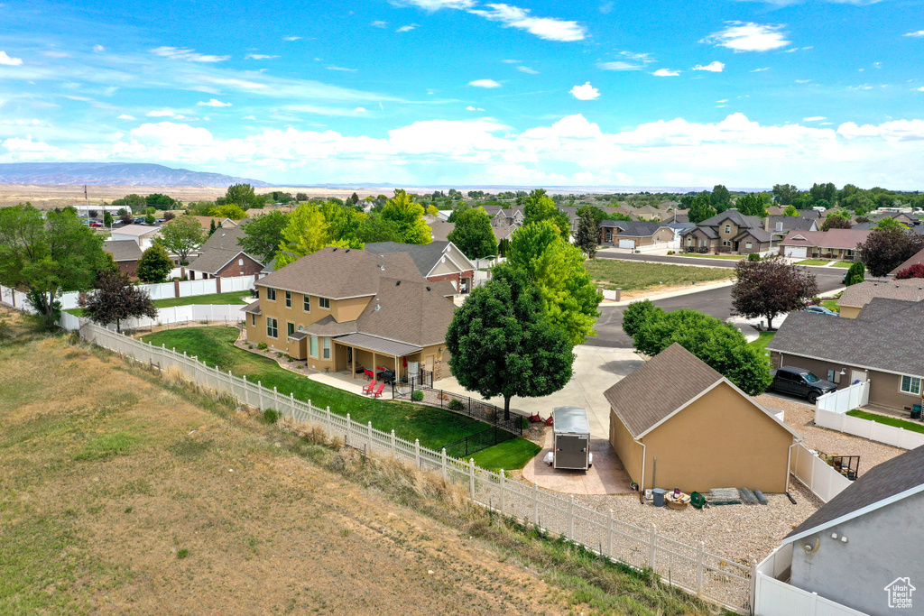 Aerial perspective of suburban area with a mountainous background