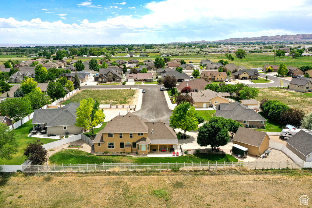 Aerial view of residential area featuring a mountainous background
