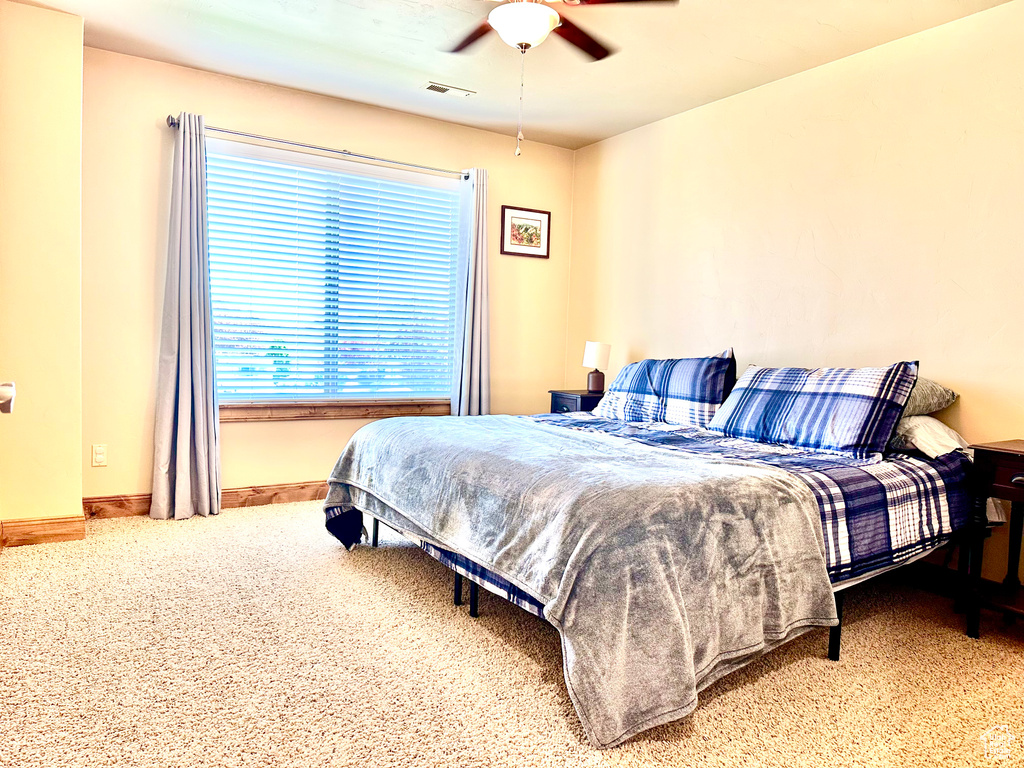 Bedroom featuring carpet flooring and ceiling fan