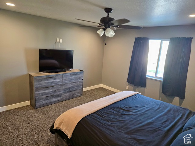 Bedroom featuring dark carpet, recessed lighting, and a ceiling fan