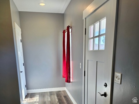Entryway featuring wood finished floors and baseboards