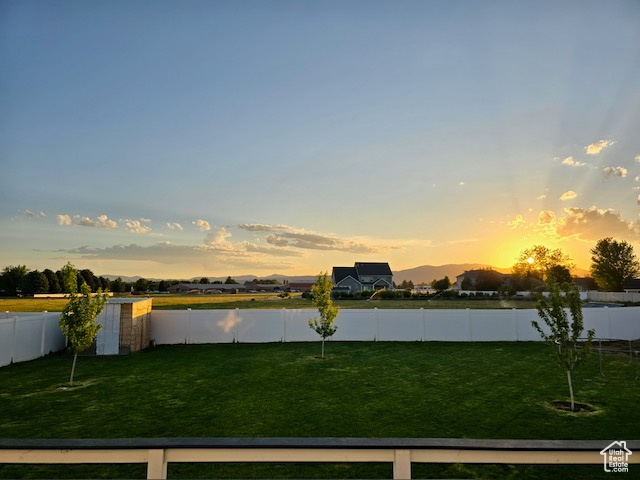 Fenced backyard with a water view