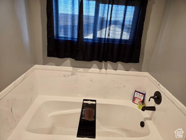 Full bathroom featuring a garden tub