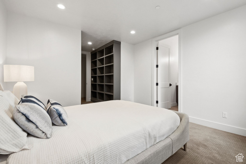 Carpeted bedroom featuring recessed lighting and baseboards