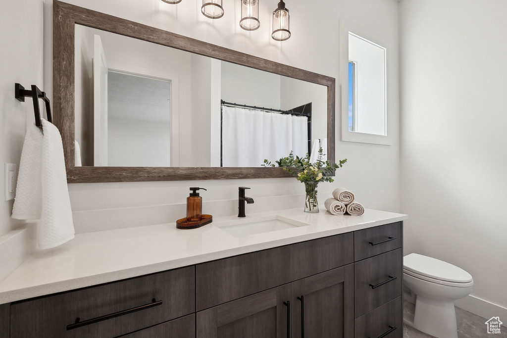 Bathroom with toilet and vanity