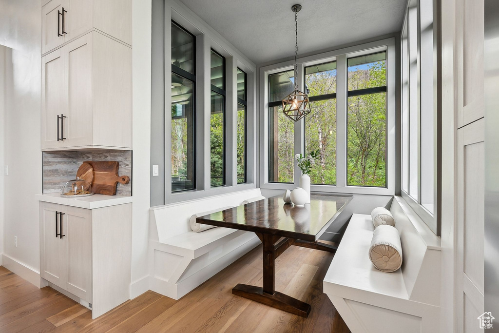 Dining area with a chandelier and light wood-type flooring