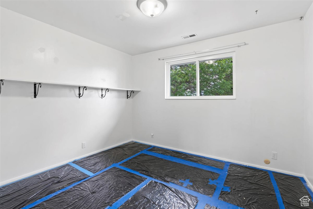 Empty room featuring baseboards