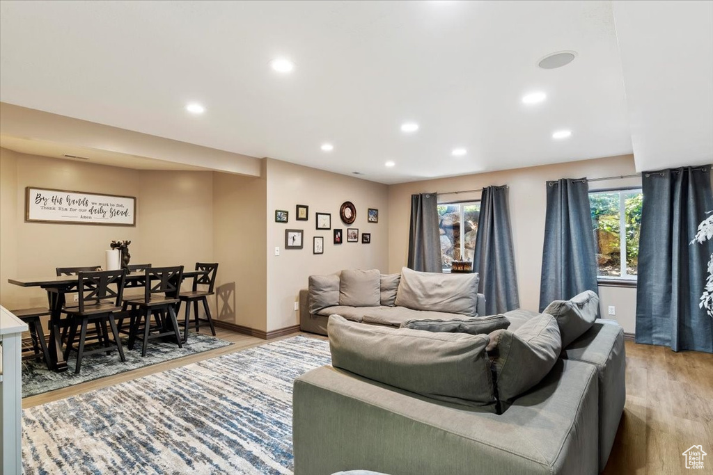 Living area featuring light wood-style flooring and recessed lighting