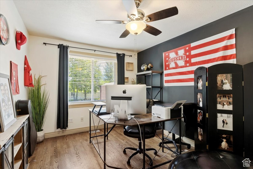 Office space featuring wood finished floors and ceiling fan