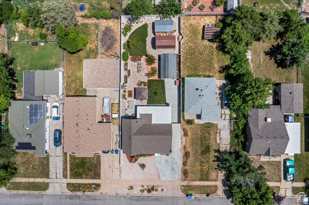Aerial view of property and surrounding area with nearby suburban area