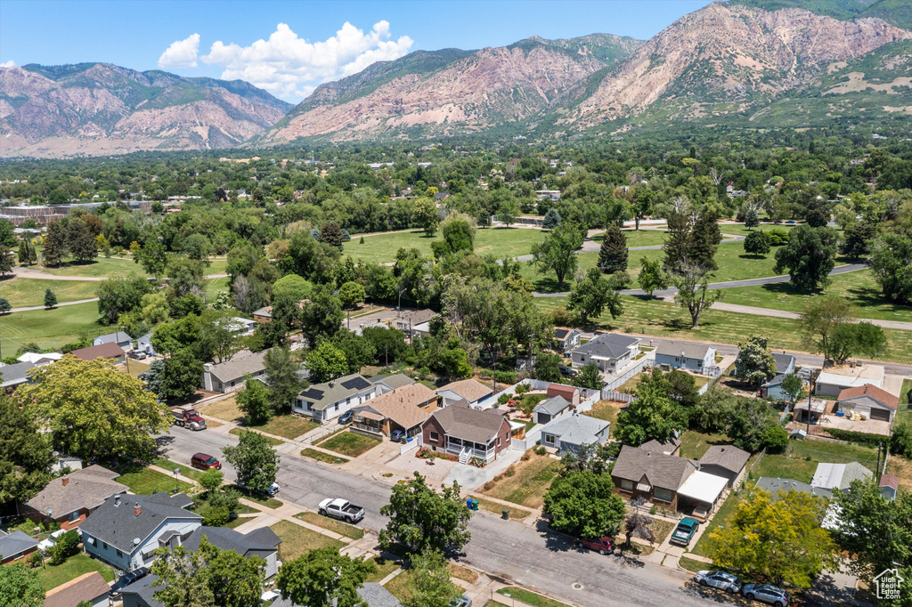 Aerial view of residential area featuring a mountainous background