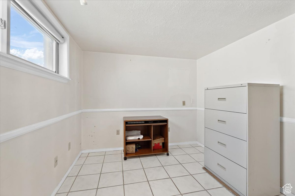 Walk in closet featuring light tile patterned floors