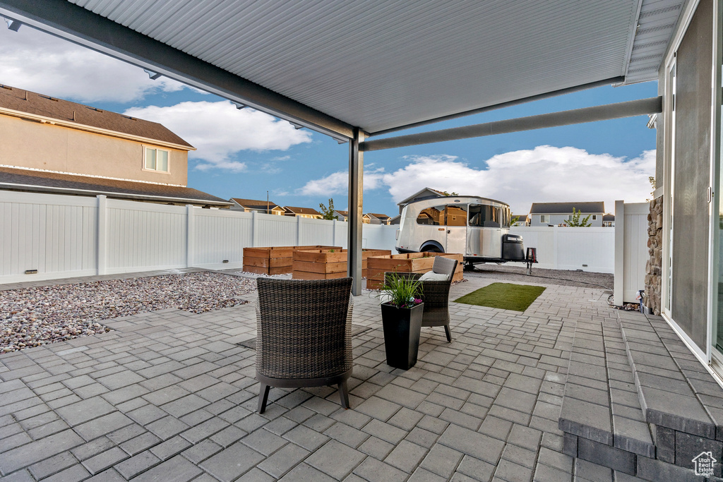 Fenced backyard with a patio