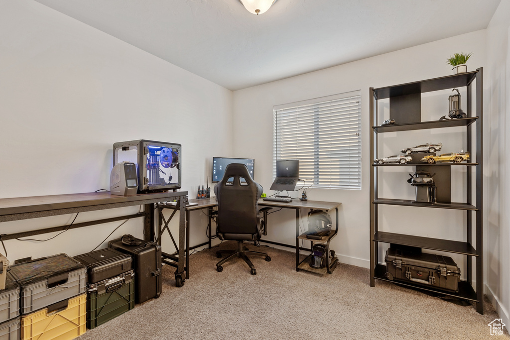 Office space featuring carpet floors and baseboards