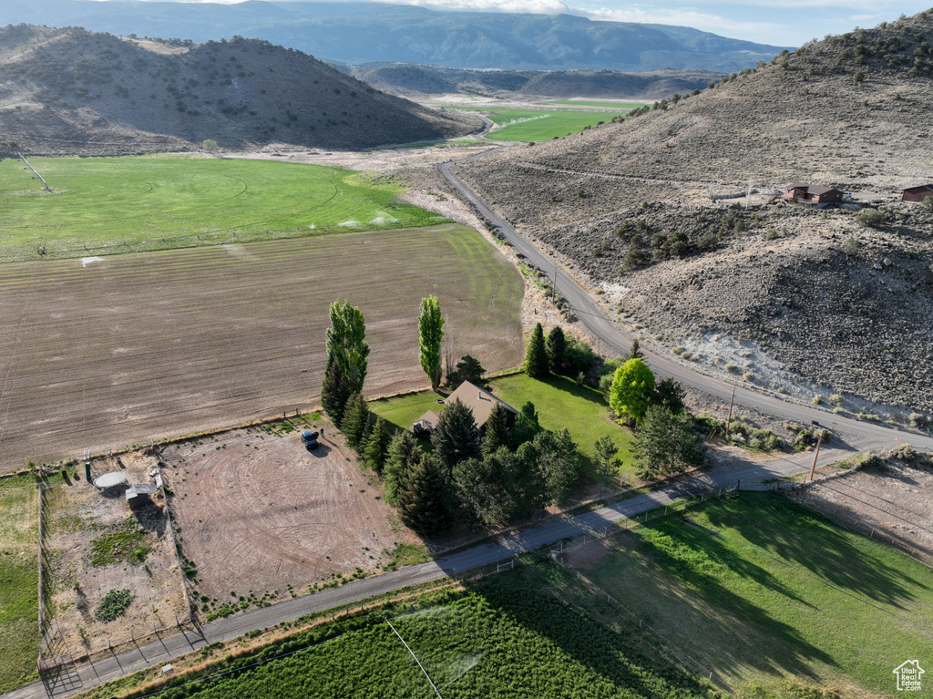 View of property location featuring a mountainous background and rural landscape