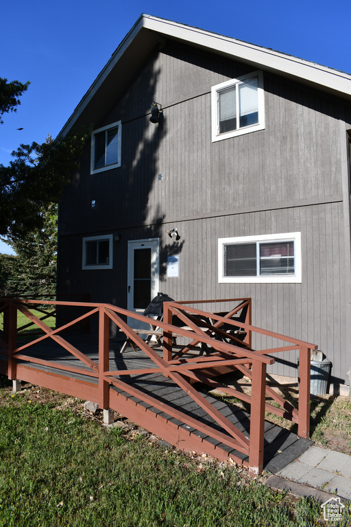 Back of property featuring a wooden deck