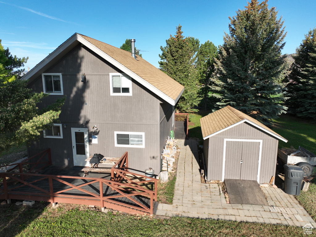 Back of property with a deck