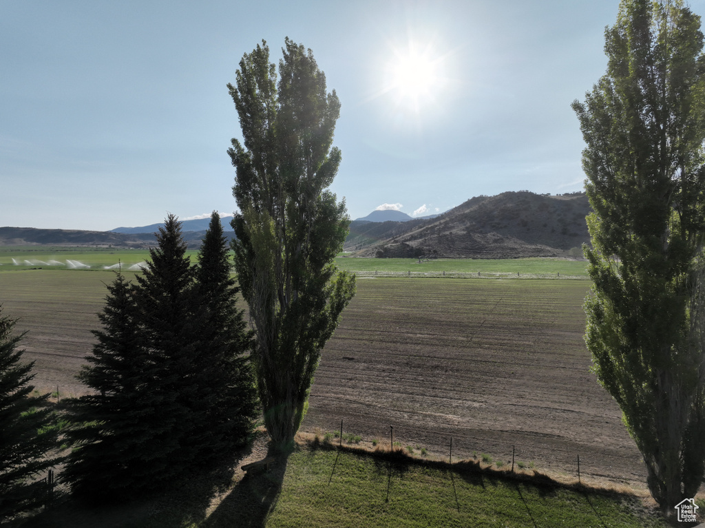 View of mountain backdrop featuring rural landscape